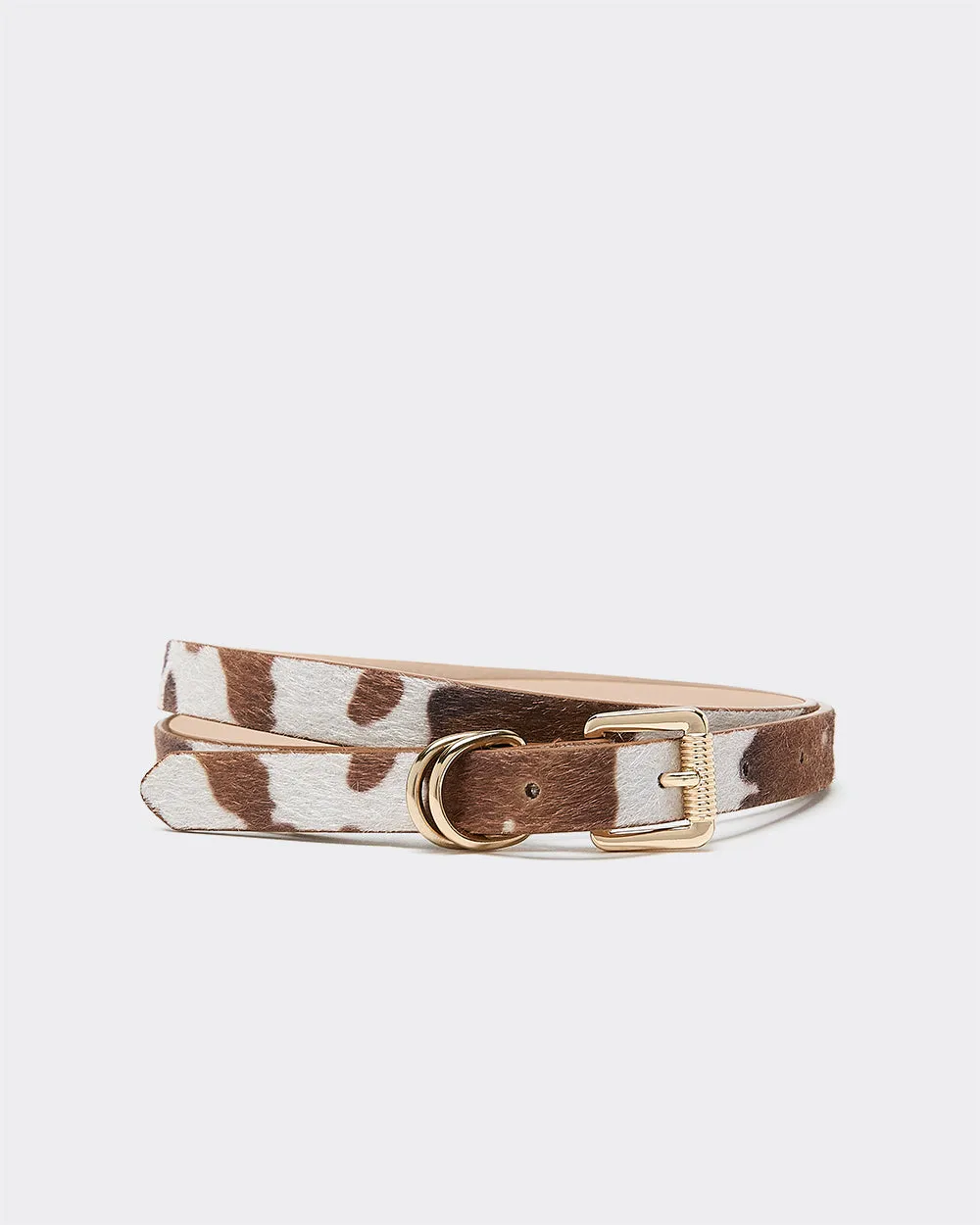 Faux Leather Belt with Cow Print sold by Reitmans