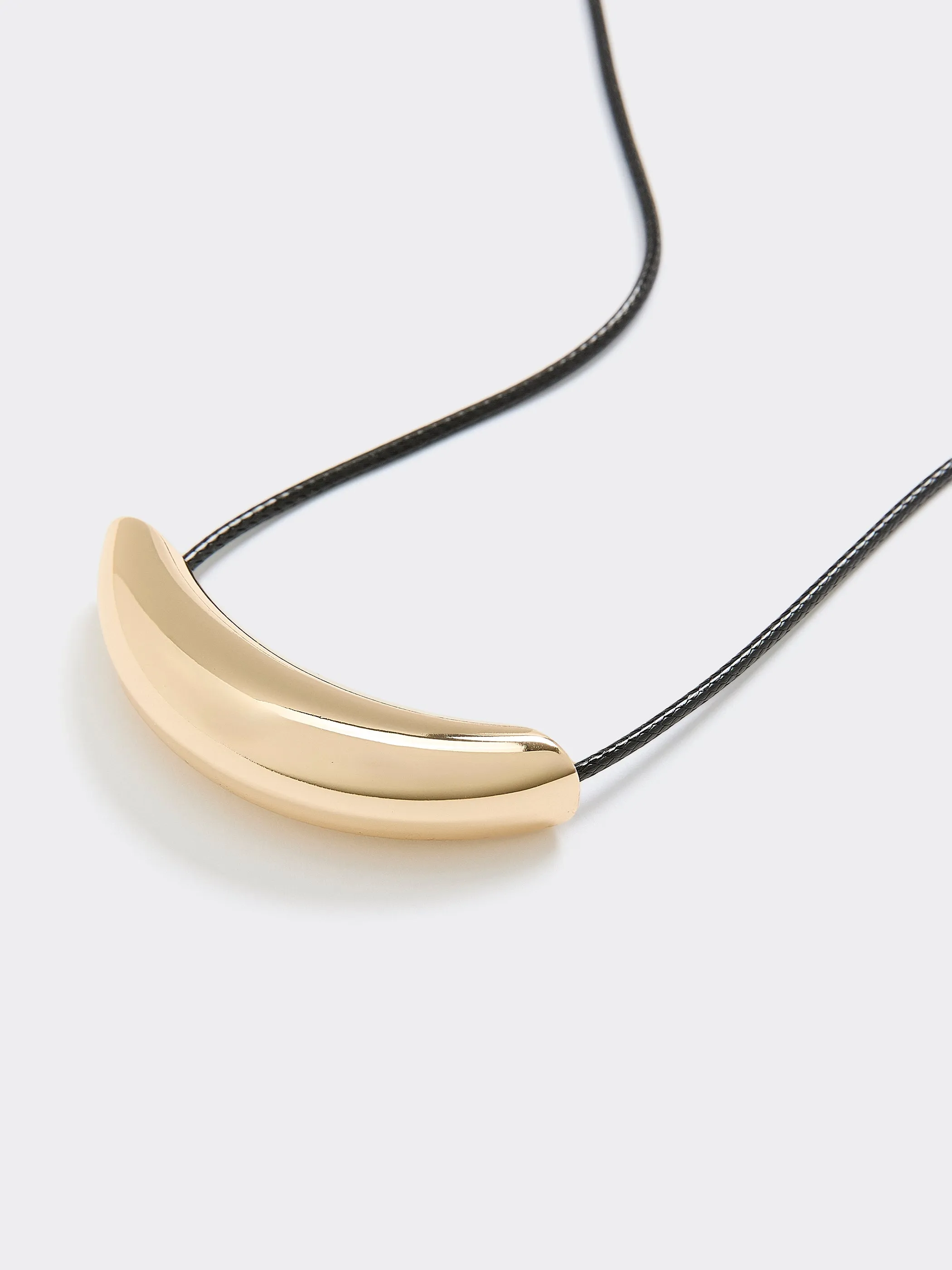 Cord Necklace with Stainless Steel Curbed Bar sold by Reitmans