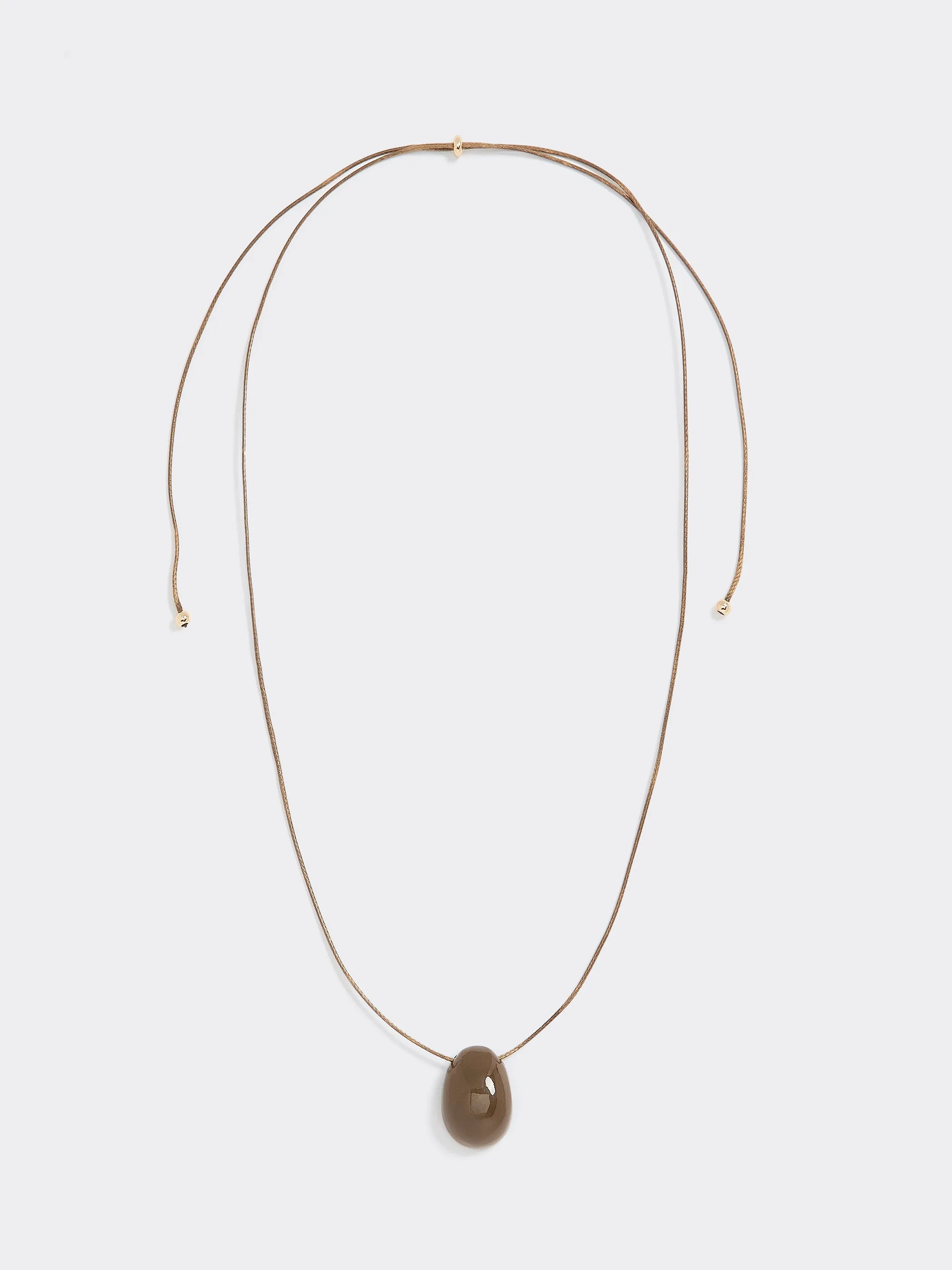Cord Necklace with Pendant sold by Reitmans