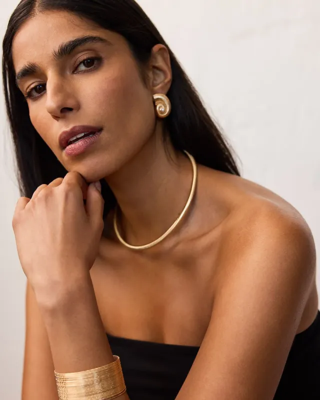 Sea Shell Earrings sold by Reitmans