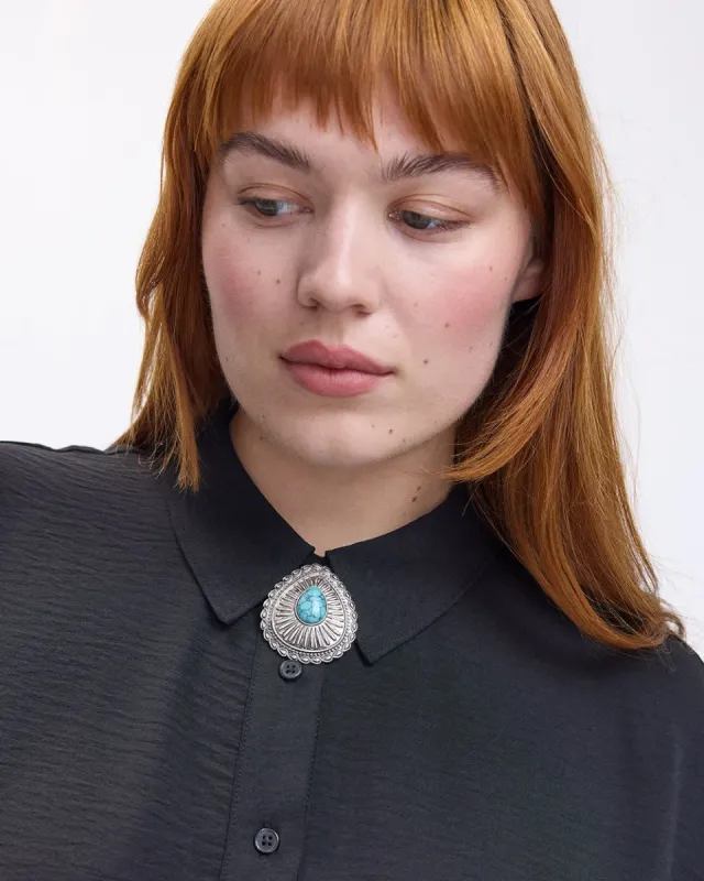Trendy Broach with Blue Stone sold by Reitmans