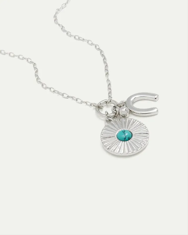 Necklace with Disc and Horseshoe Pendants sold by Reitmans