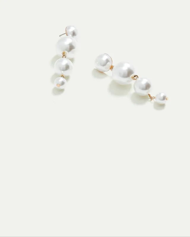 Stud Earrings with Pearl Pendants sold by Reitmans