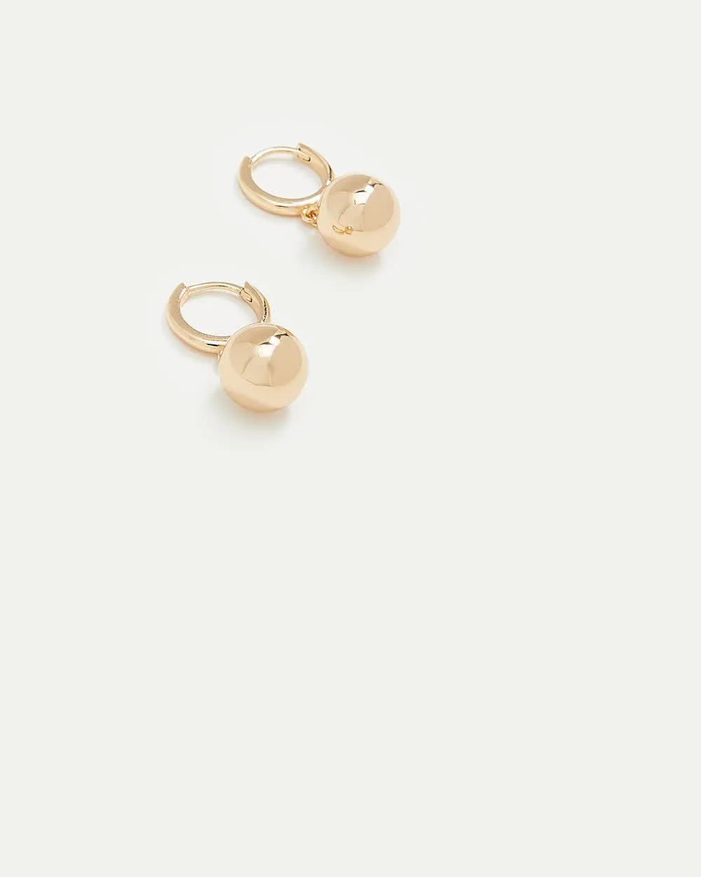 Small Hoops with Ball Pendants sold by Reitmans