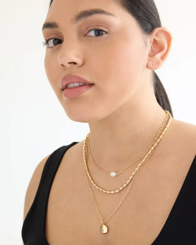 Multi-Chain Short Necklace with Pearl Pendant sold by Reitmans