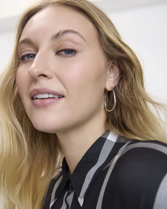 Thick Elongated Hoops sold by Reitmans