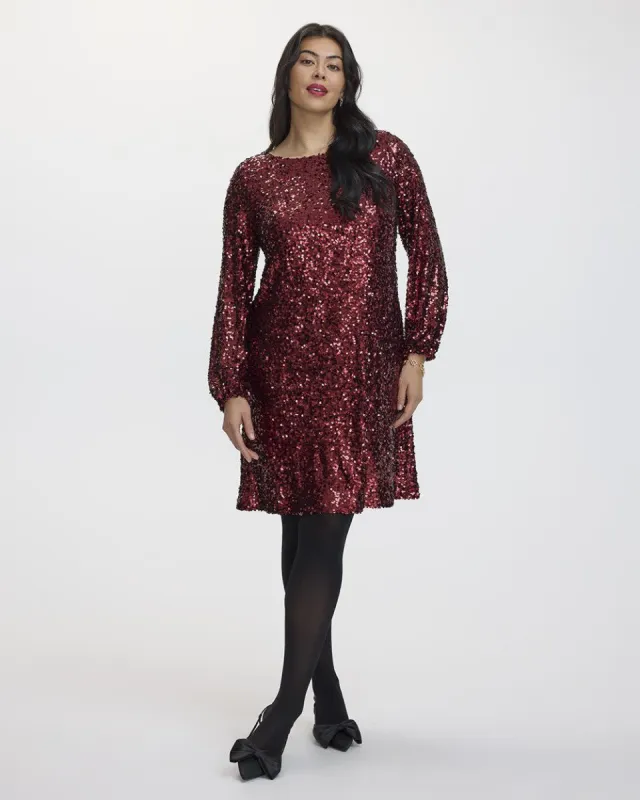 Long-Sleeve Sequin Shift Dress with Bow at Back sold by Reitmans