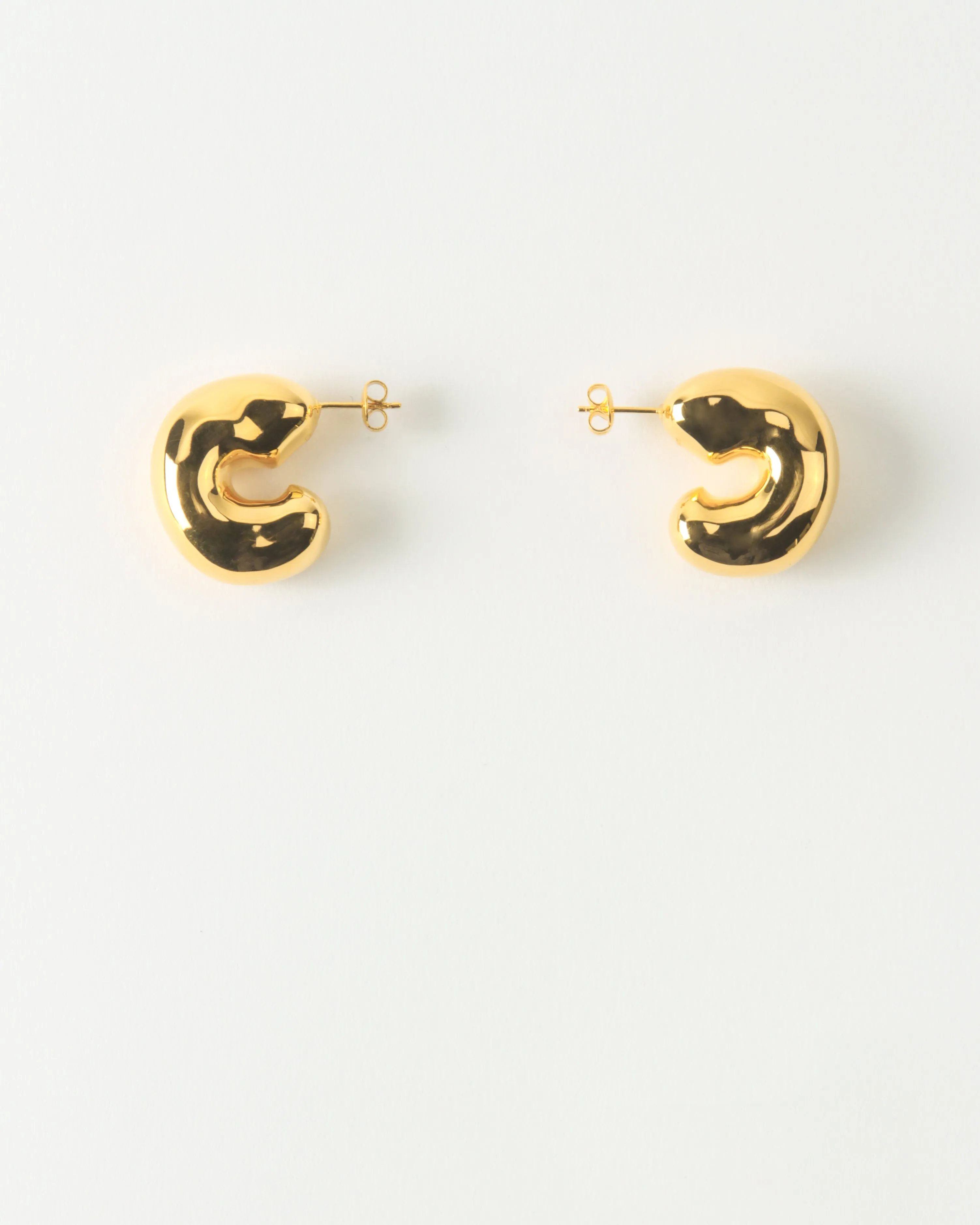 Large Molten Hoops Gold Plated sold by Rejina Pyo