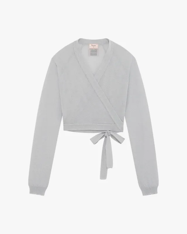 Cache-cœur pailleté sold by Repetto