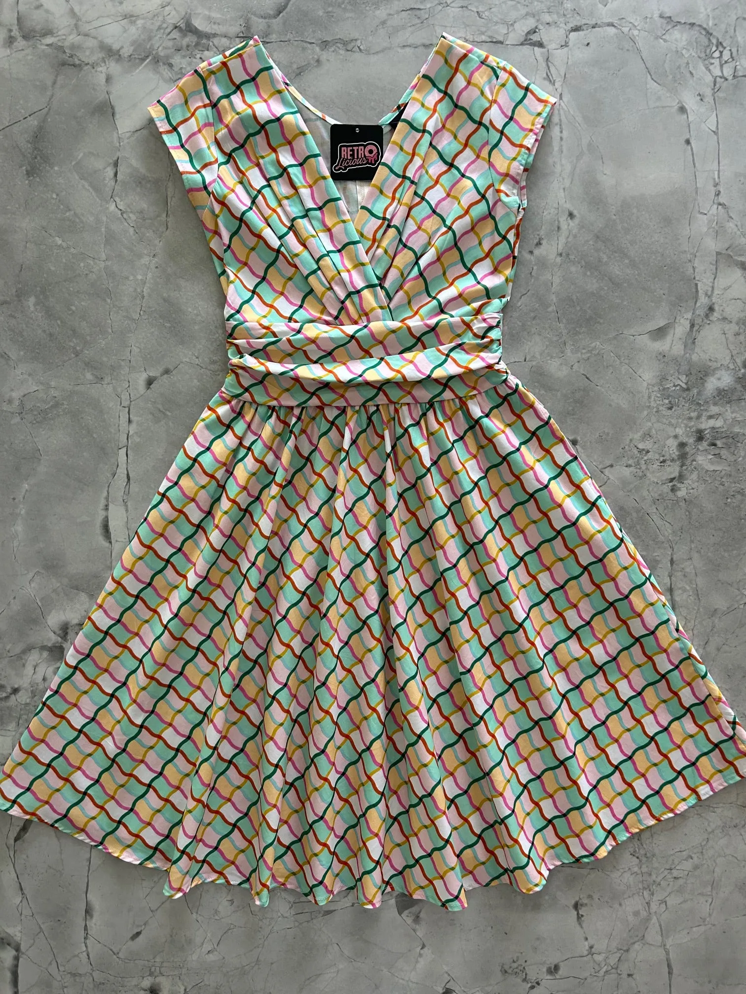 Squiggly Greta Dress sold by Retrolicious