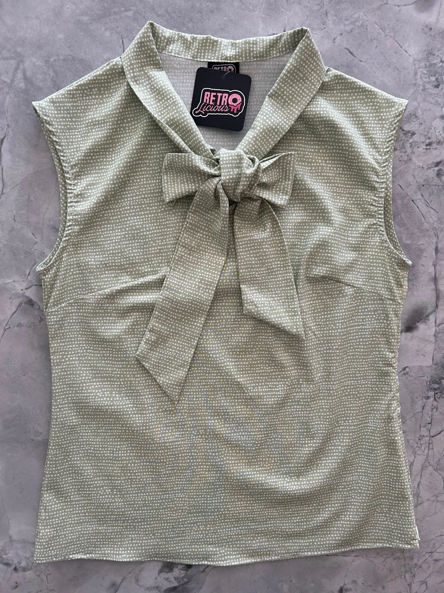 Sage Dot Bow Top sold by Retrolicious