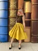 Peggy Swing Skirt in Mustard sold by Retrolicious