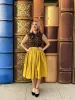 Peggy Swing Skirt in Mustard sold by Retrolicious