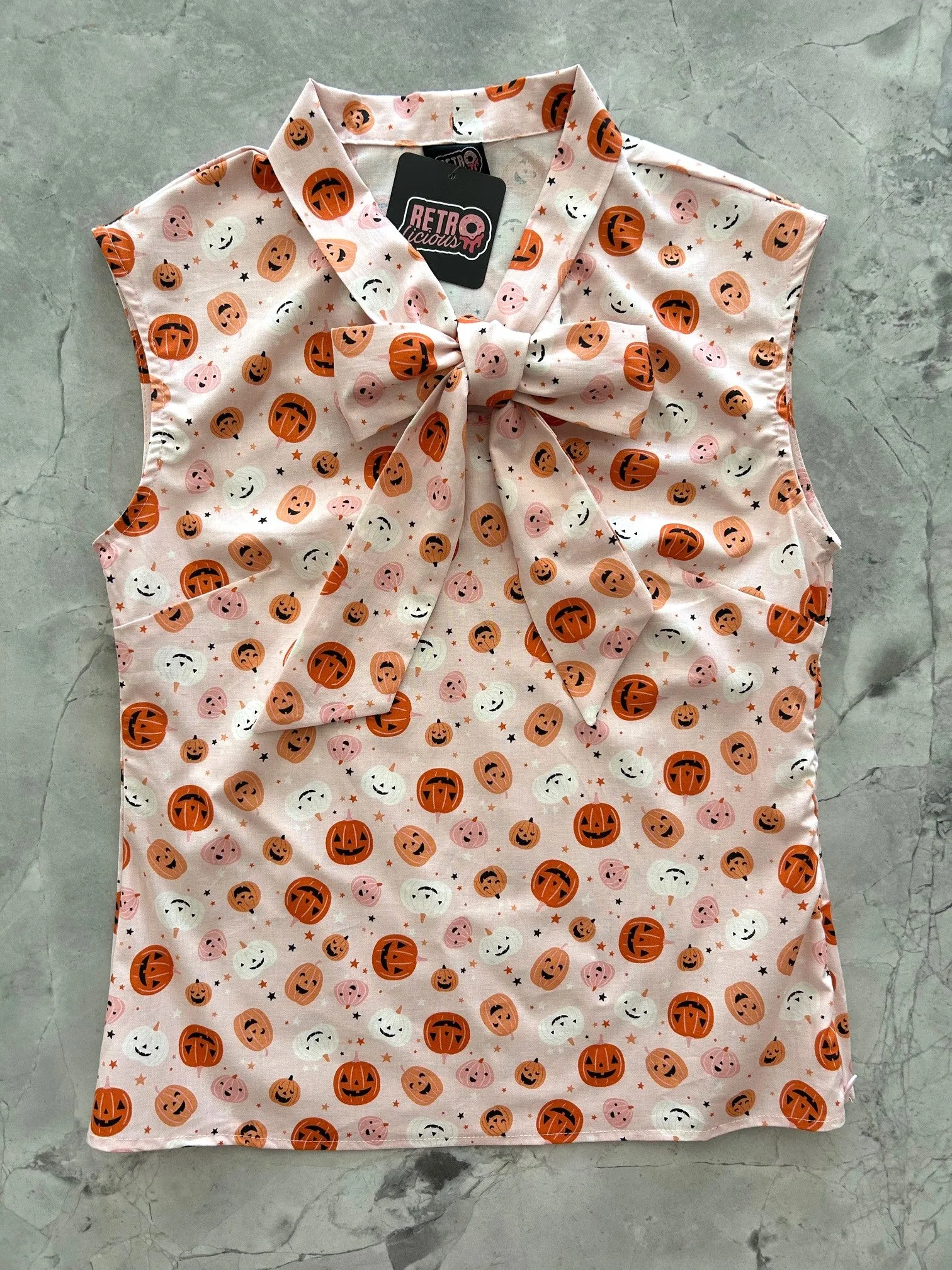 Pink Jack-o’-lantern Bow Top sold by Retrolicious