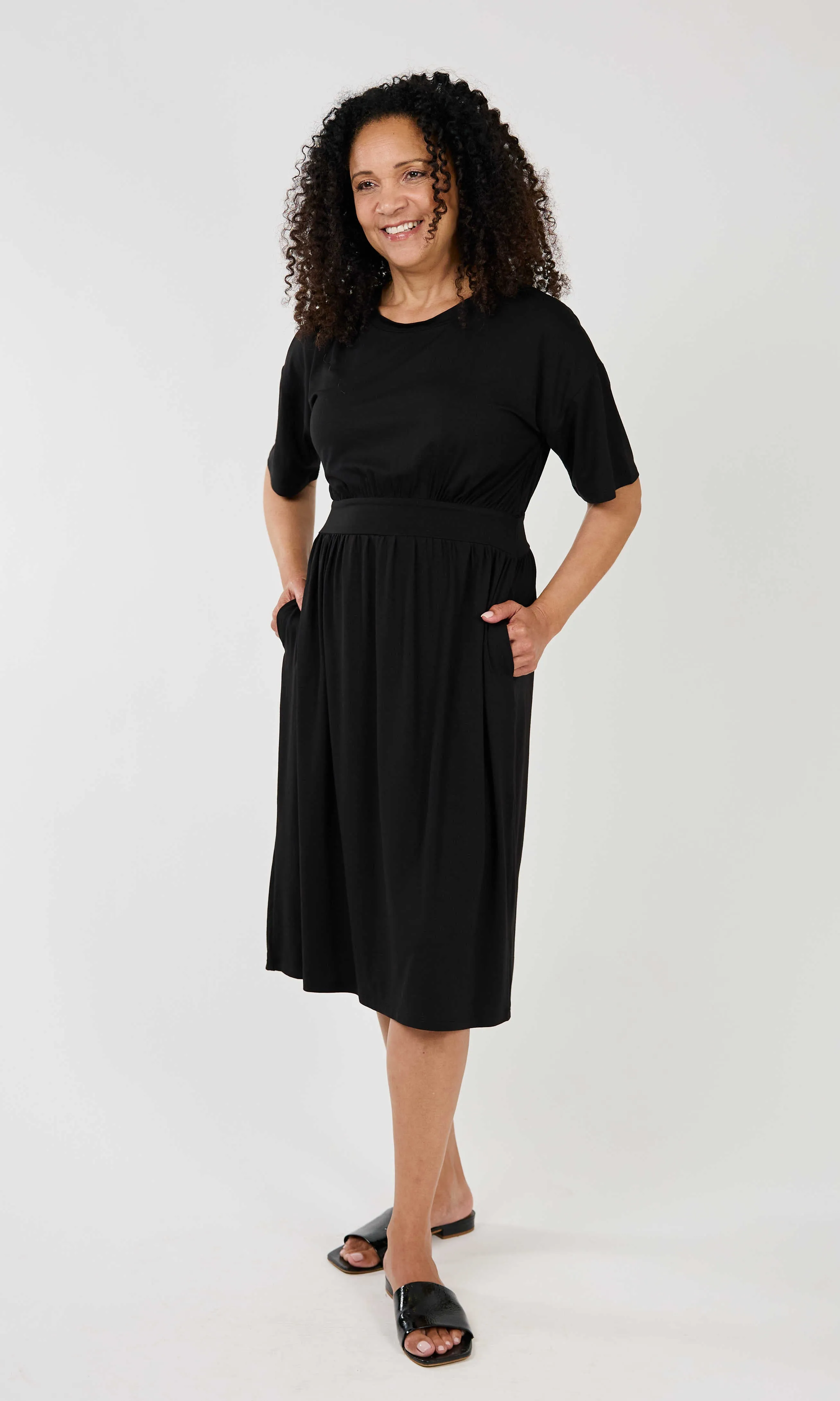 Pleated Dress sold by Revolution Boutique