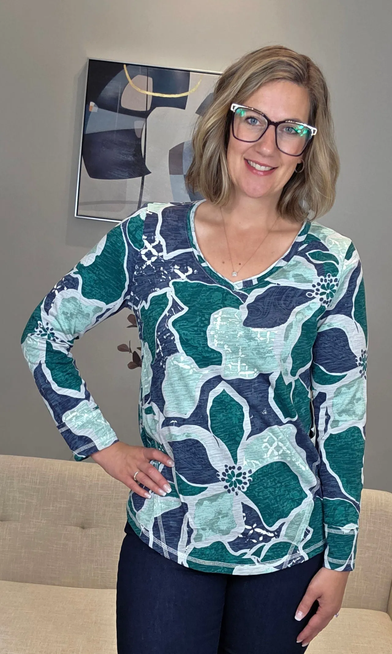 Exposed Stitch Floral Top sold by Revolution Boutique