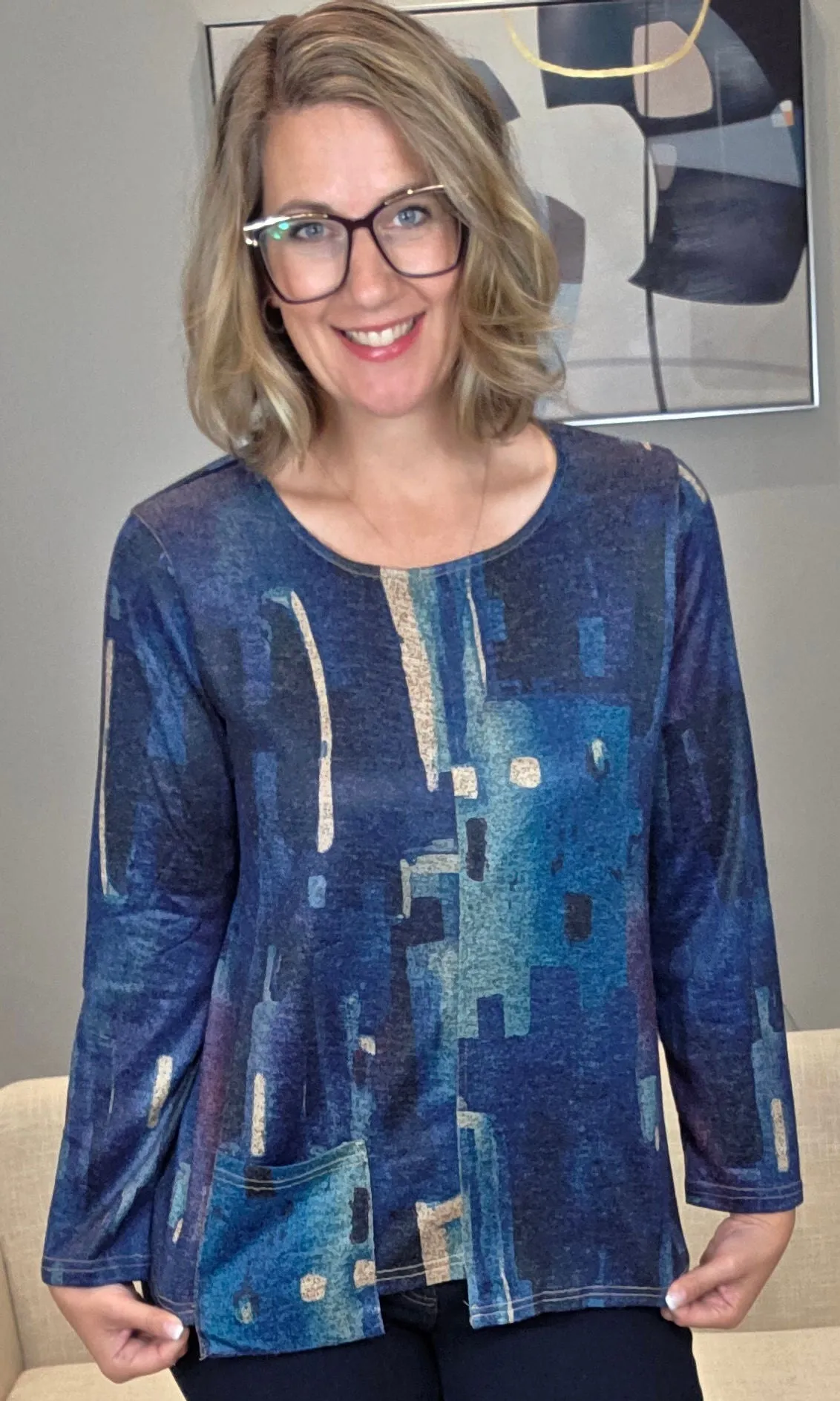 Asymmetrical Pocket Top sold by Revolution Boutique