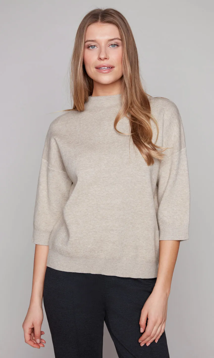 Mock Neck Ribbed Hem Sweater sold by Revolution Boutique