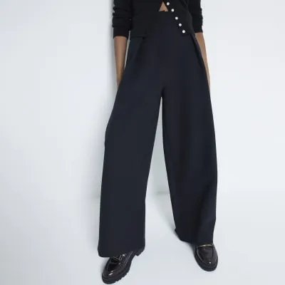 Black premium high waisted wide leg trousers sold by River Island