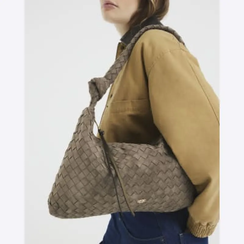 Khaki Knot Handle Woven Slouch Bag sold by River Island
