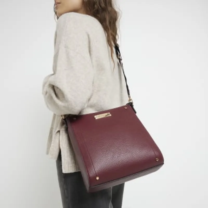Red textured messenger cross body bag sold by River Island