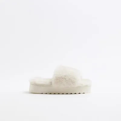 Cream faux fur open toe platform slippers sold by River Island