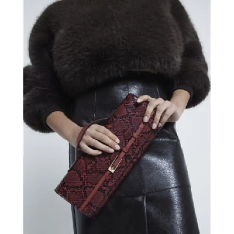 Red Snake Buckle Cross Body Strap Clutch Bag sold by River Island