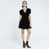 Black velvet v-neck mini dress sold by River Island