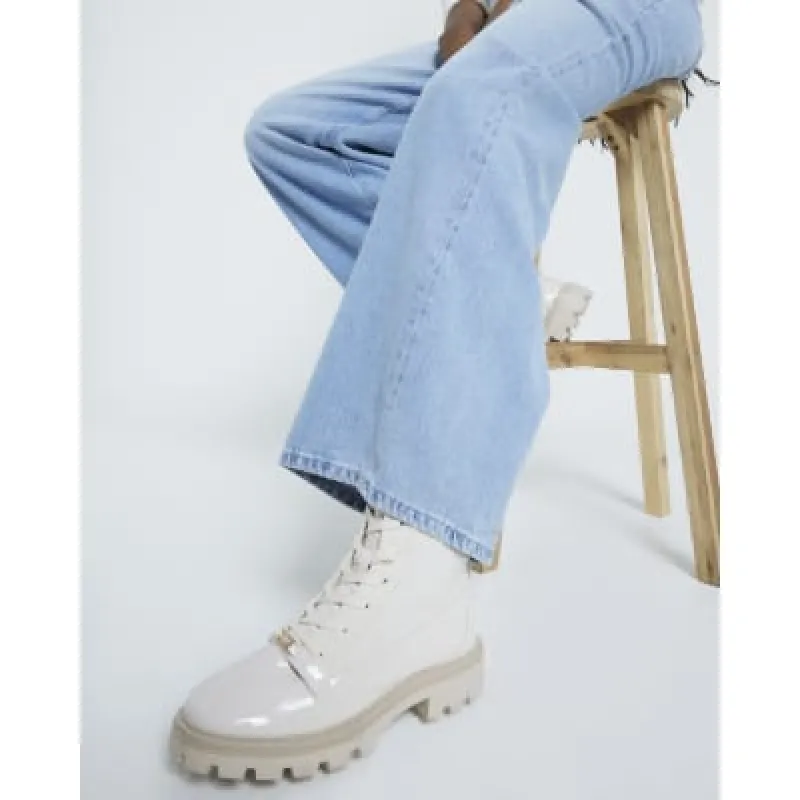 Cream wide fit lace up ankle boots sold by River Island