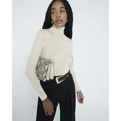 Cream Glitter Roll Neck Top sold by River Island
