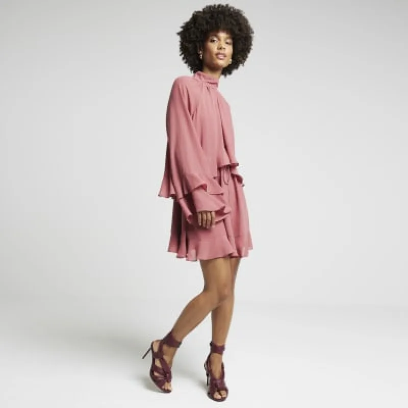 Pink layered ruffle smock mini dress sold by River Island