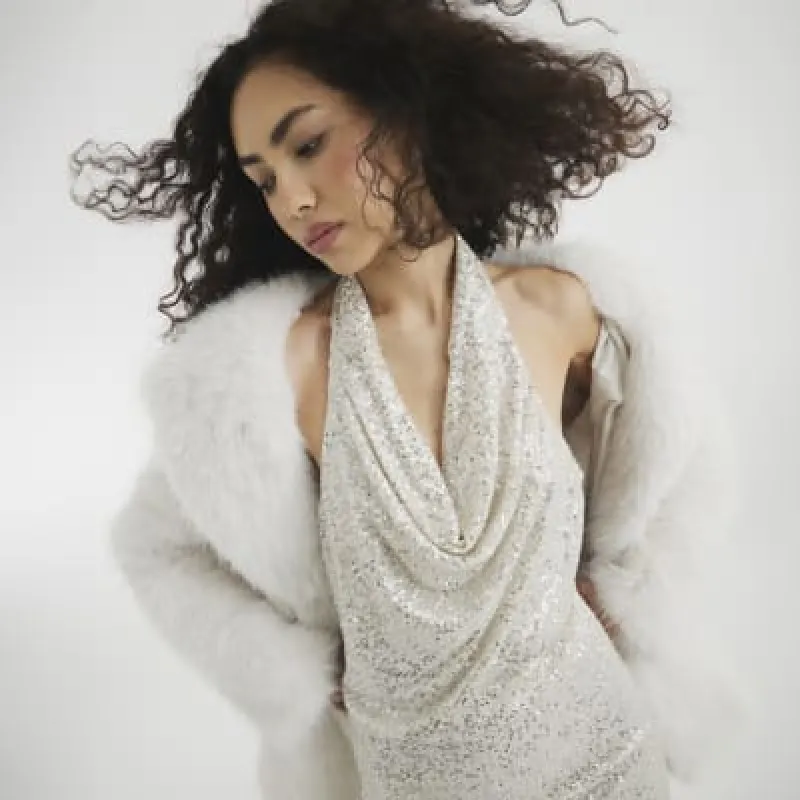 Cream Sequin Halterneck Shift Mini Dress sold by River Island