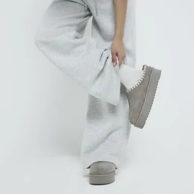 Grey faux fur lining platform mules sold by River Island