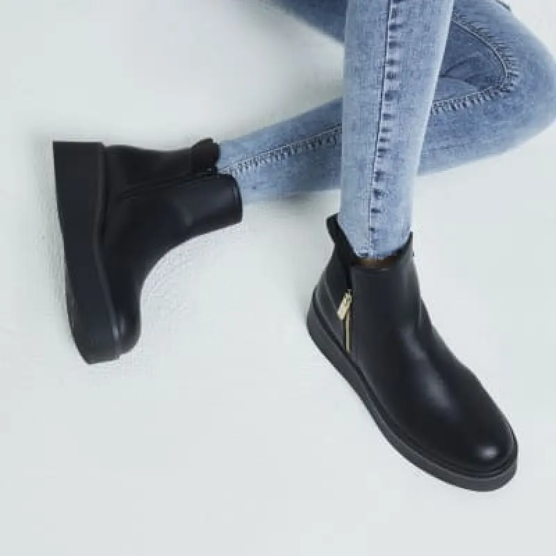 Black chunky wedge ankle boots sold by River Island
