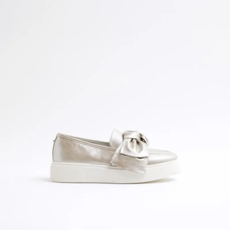 Rose Gold Faux Leather Slip On Bow Trainers sold by River Island