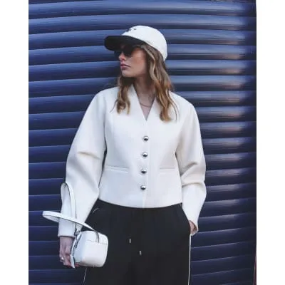 Cream Collarless Button Up Jacket sold by River Island