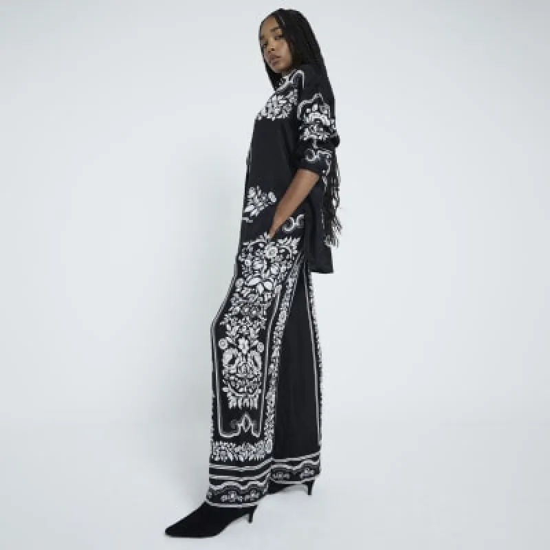 Black Wide Leg Floral Print Trousers sold by River Island