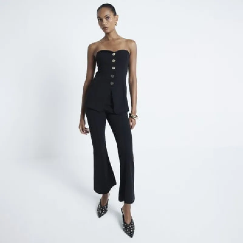 Black bootcut cropped trousers sold by River Island