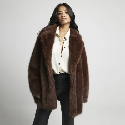 Petite Brown faux fur coat sold by River Island