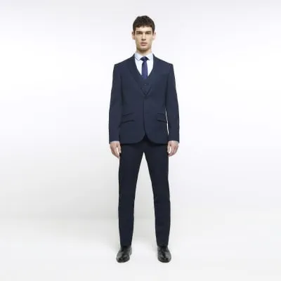 Navy skinny fit herringbone suit trousers sold by River Island