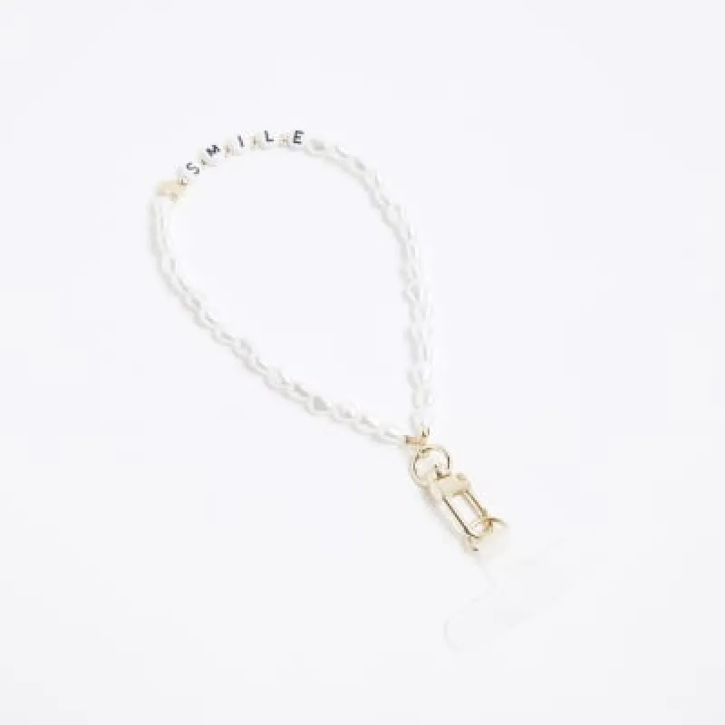 White Smile Pearl Phone Chain sold by River Island
