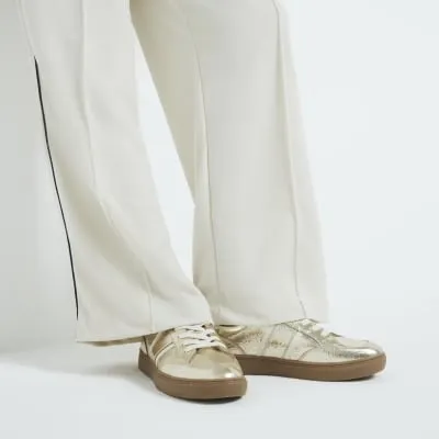 Gold Metallic Lace Up Trainers sold by River Island
