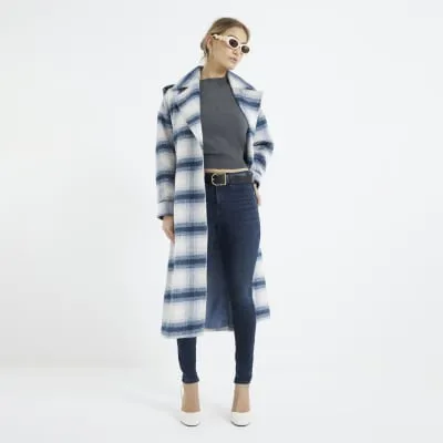 Indigo mid rise molly sculpted jeans sold by River Island