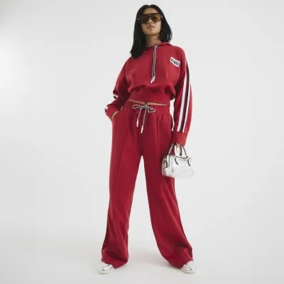 Petite Red Side Stripe Wide Leg Joggers sold by River Island