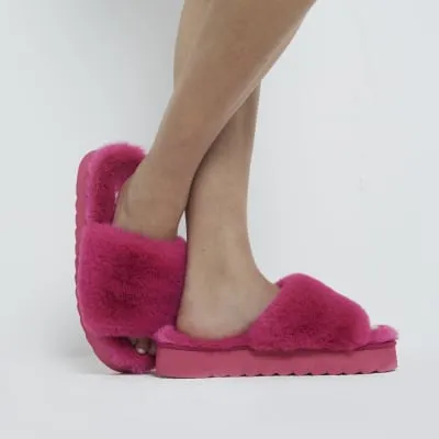 Pink faux fur open toe platform slippers sold by River Island