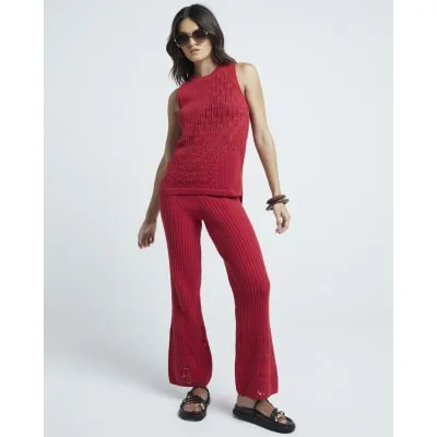 Red crochet trousers sold by River Island