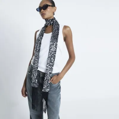 Silver sequin skinny scarf sold by River Island