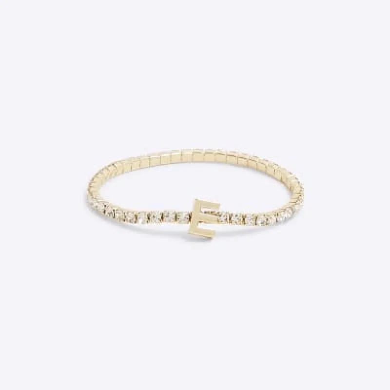 Gold Initial E Bracelet sold by River Island