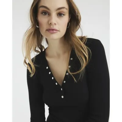 Black Ribbed Long Sleeve Popper Top sold by River Island