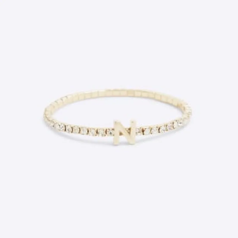 Gold Initial N Bracelet sold by River Island